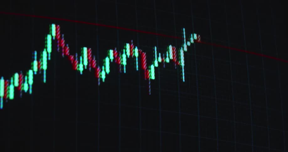 The financial markets get hit by a black swan event causing a massive crash or recession leading to a global economic crisis and great depression symbolized by a trading chart or graph that sharply falls into the red digits with dramatic downward movement