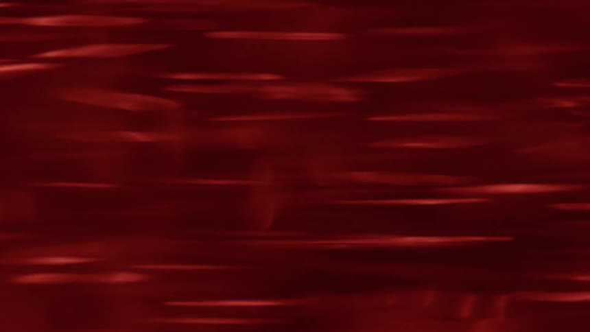 The rain is pouring under the red light