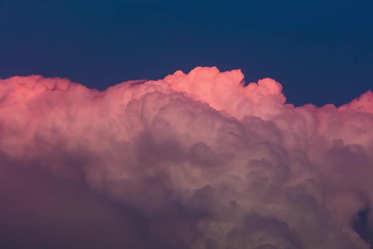 Heavy clouds outdoors on the sky moving during dusk or dawn and day time