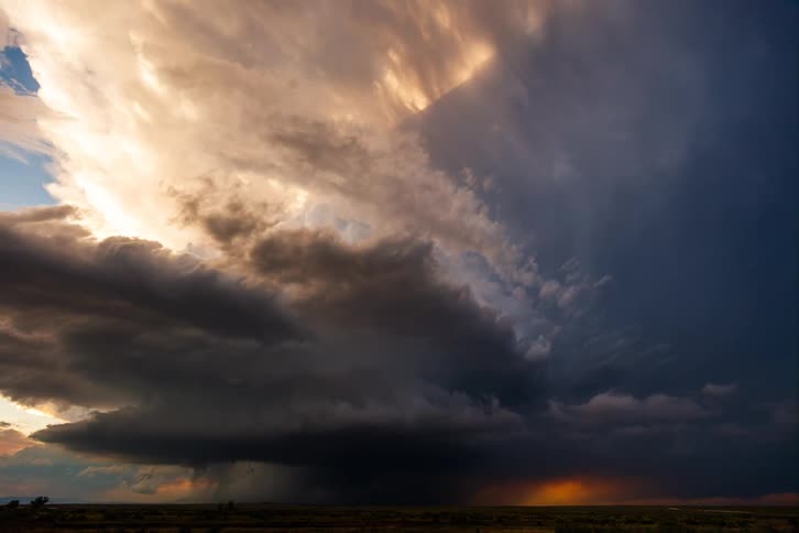 The rain pours and the clouds flash during a large storm