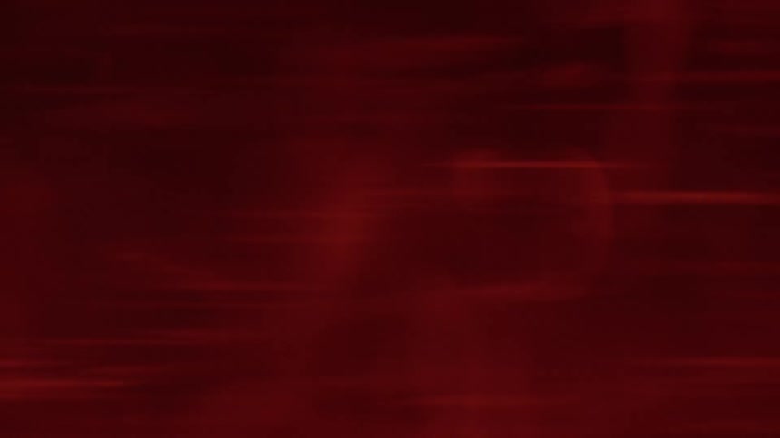 Red blurs of light and subtle horizontal lines move and flicker across a dark red background creating a textured and slightly chaotic abstract effect