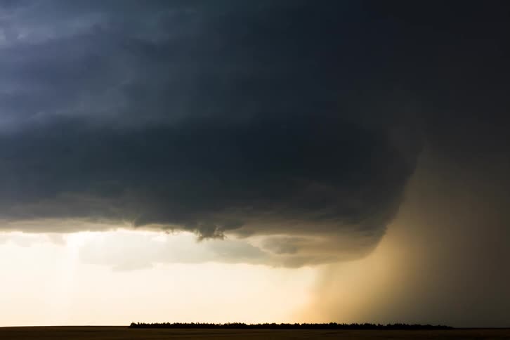 Dark stormfilled clouds covering the sky at midday