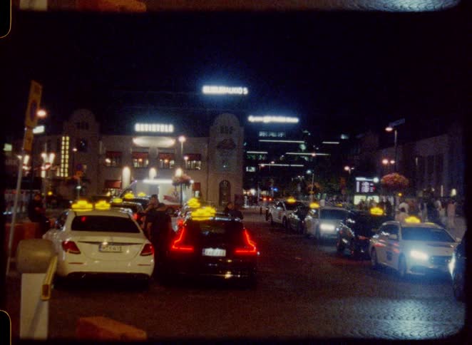 Pedestrians and vehicles fill the street