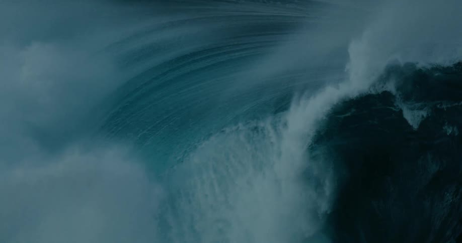 The huge wave falls and crashes