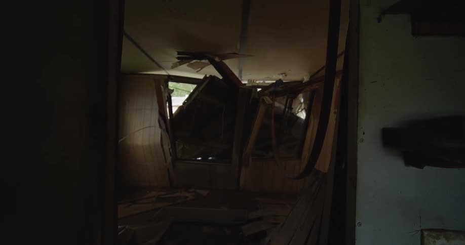 A ruined building structure with cracked walls