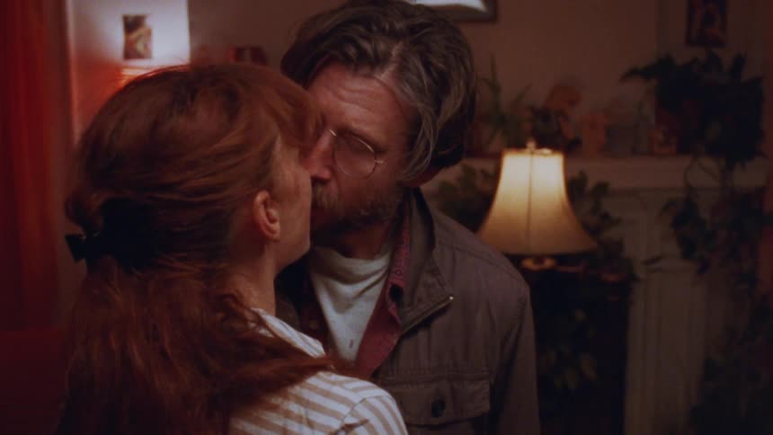 The man and woman kiss and hug