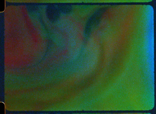 Bubbles form in the rainbow colored paint