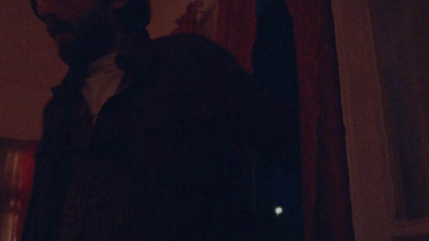 The man and woman enter the room at night