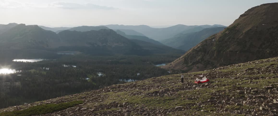 A person is camping on the mountain