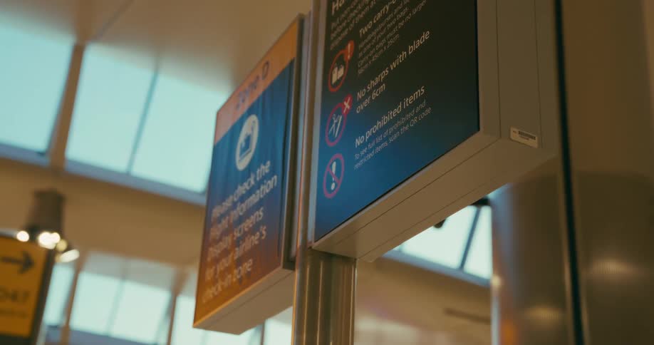Signs are posted on the door inside the building