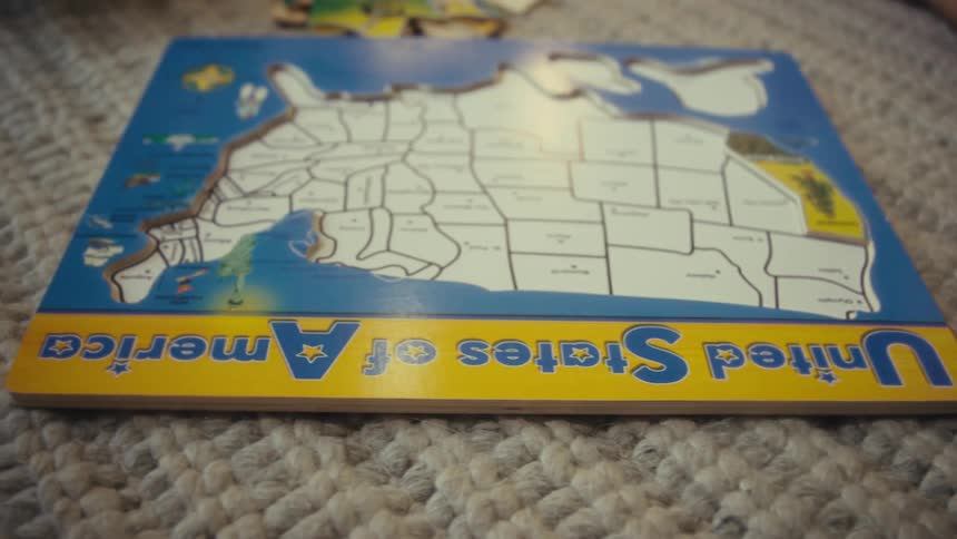 Incomplete united states puzzle on a carpet