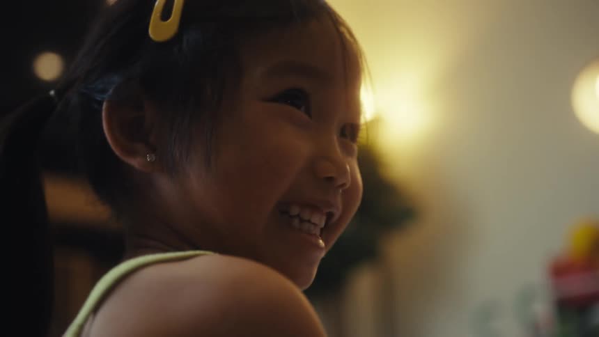 Two kids a boy and a girl playing together in the living room