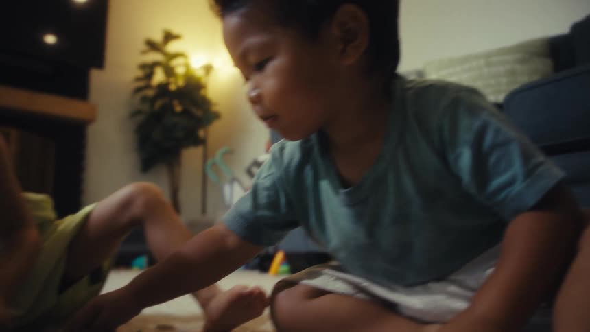 Two children putting together a puzzle
