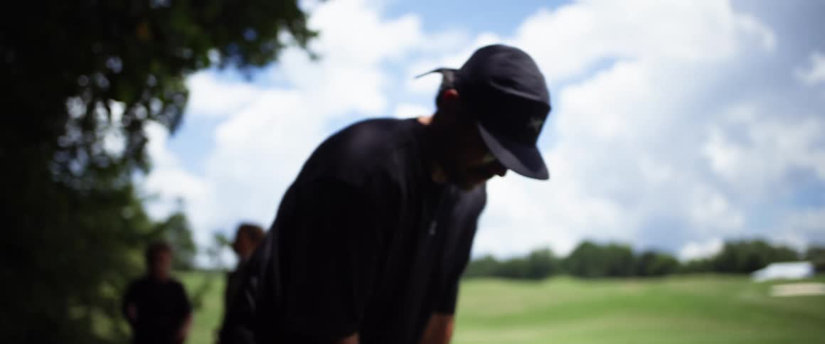 Family outdoors playing golf
