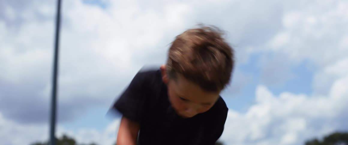 The child swings the golf club