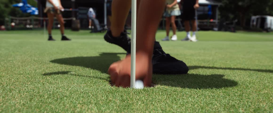 Person catching a golf ball