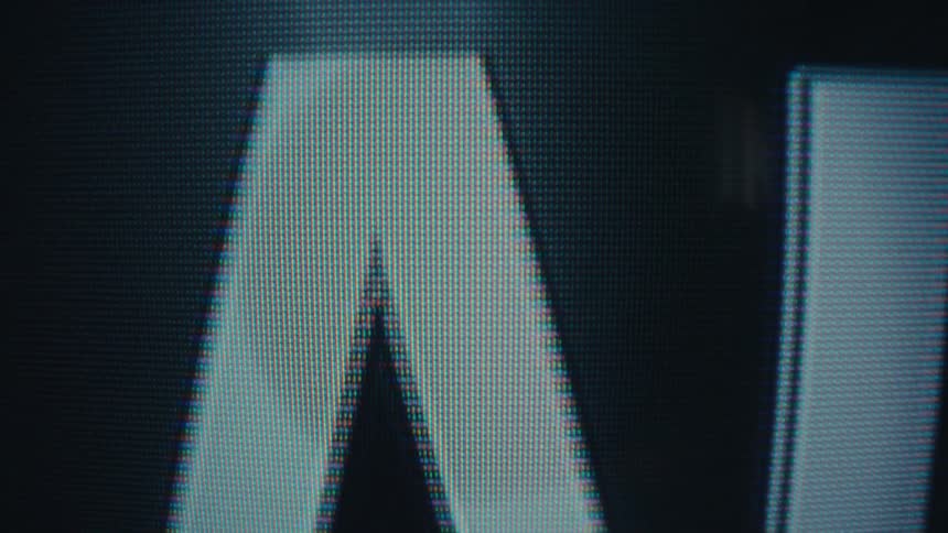 Enlarged letter a appears on a screen with visible pixels