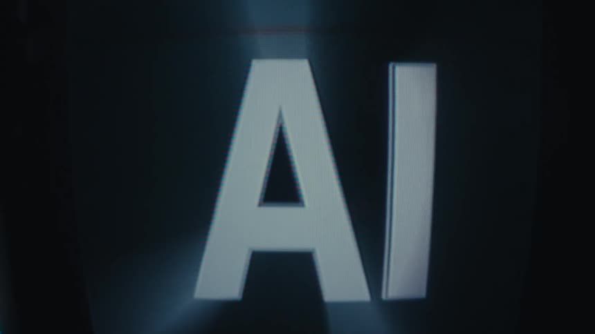 The capital letters a and i with a shiny metallic surface move and fade out from a black background