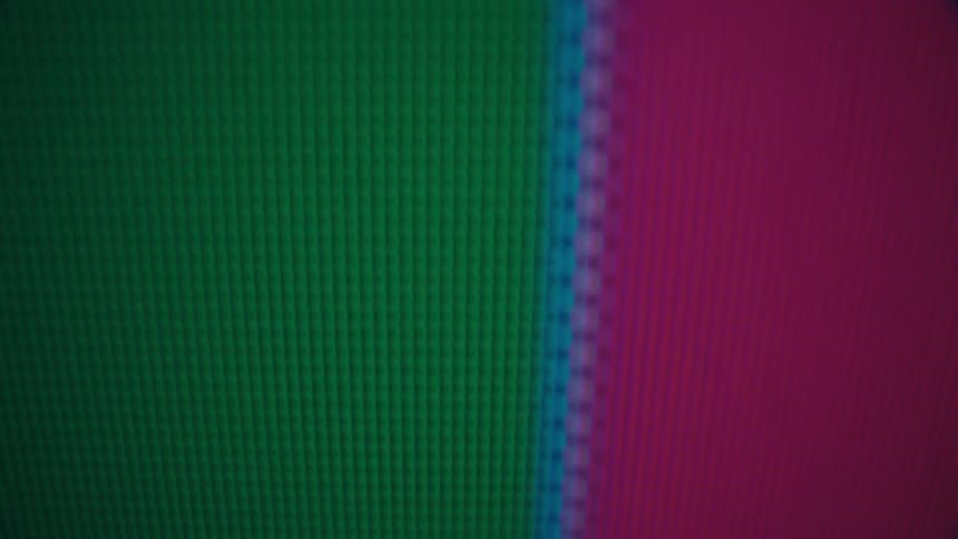 Monitor screen displaying vertical colored stripes in closeup