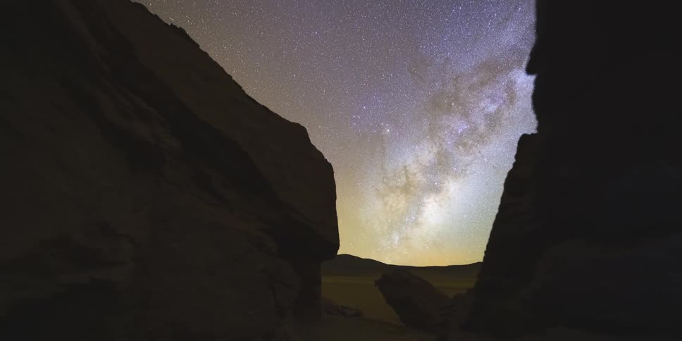 The milky way shines above the cavern