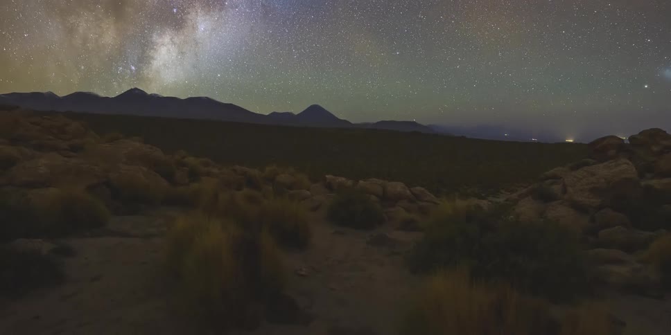 Starry sky in a natural area with the silhouette of mountains on the horizon