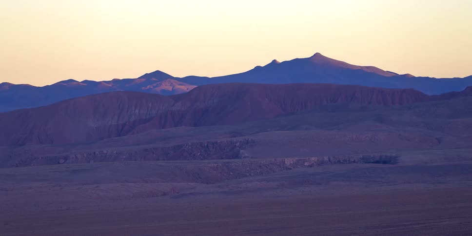 The sun flashes on the valley