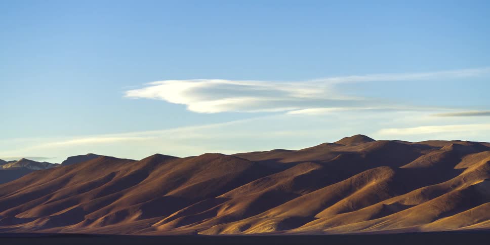 Landscape of a mountain valley as the day darkens