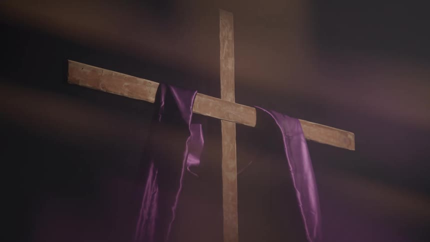 Purple scarf on a wooden cross