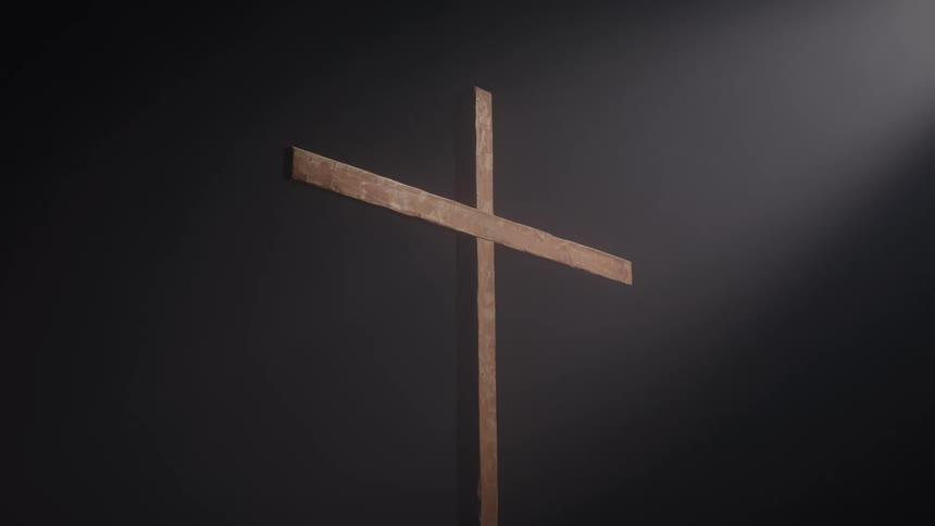 A spotlight on a wooden cross