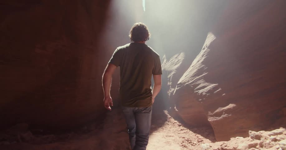 The man walks in the cave