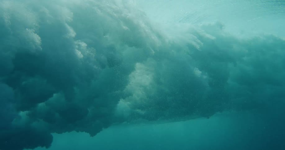 The waves crash underwater