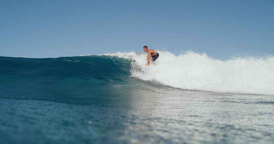 White man surfing over a sea wave outdoors during day time