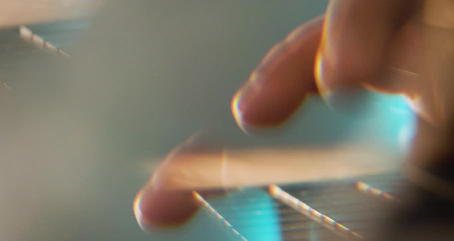 Pair of hands typing quickly on a keyboard