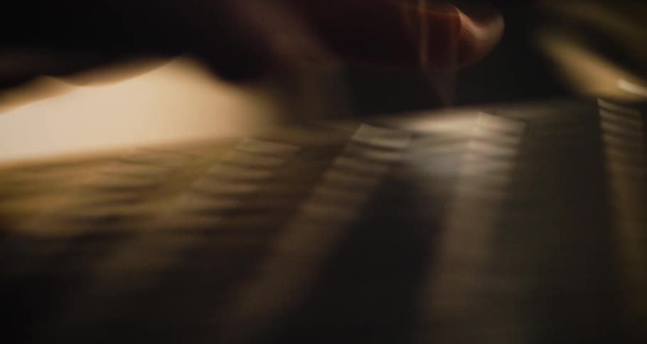 The person is typing on the keyboard