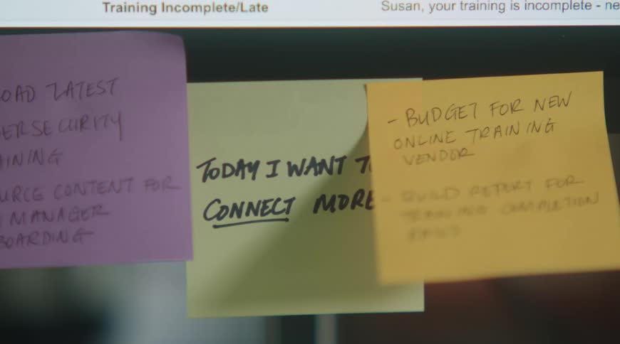 Monitor with colorful sticky notes displaying reminders and task notes