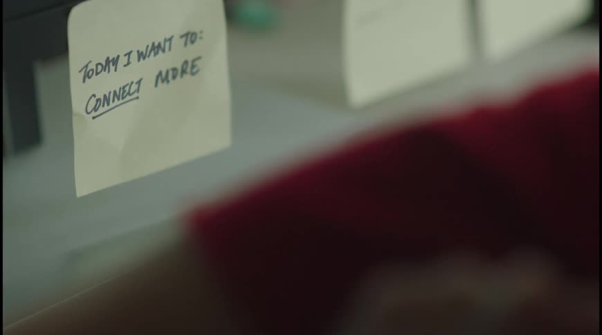 Yellow sticky note on the monitor says today i want to connect more