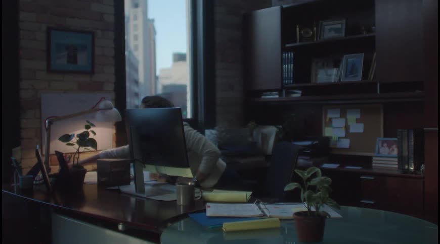 A woman working in an office at her home
