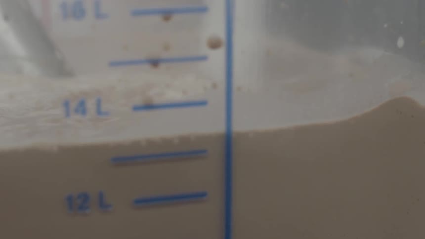 Sugar is poured into a large mixing vat