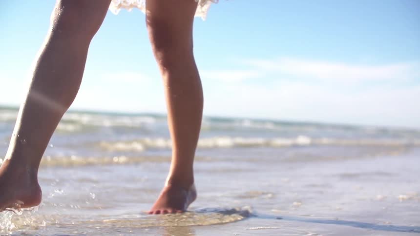 Woman walking on the beach