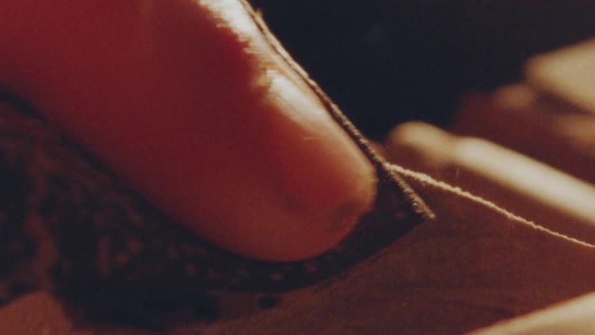 Finger slides over a dustcovered surface