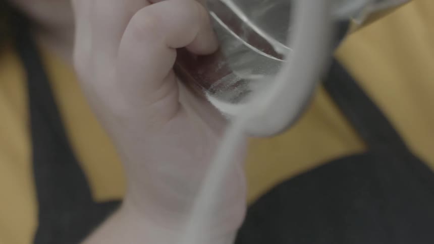 A bowl is being poured into a container