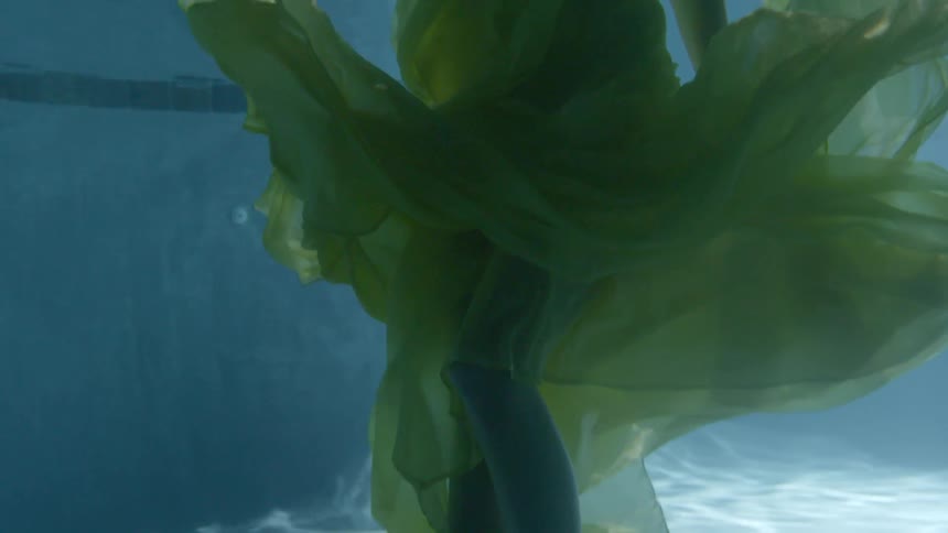 A woman walks in the water