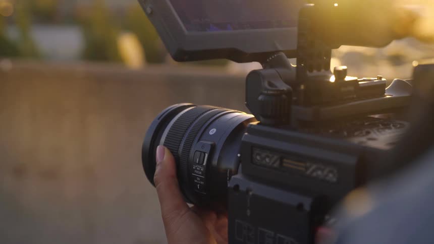 A person focuses their camera