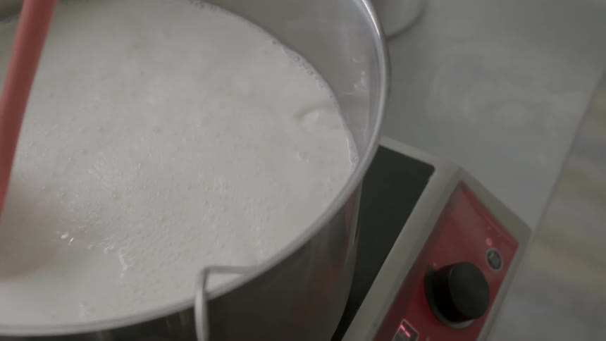 Ingredients are mixed in a large pot
