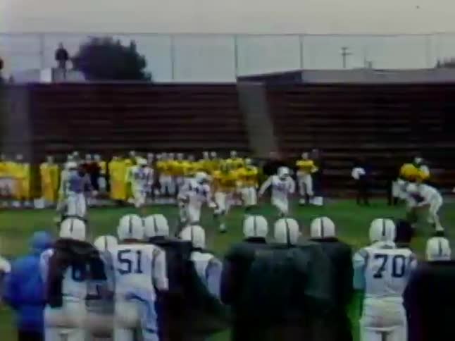 Two teams play football on a field