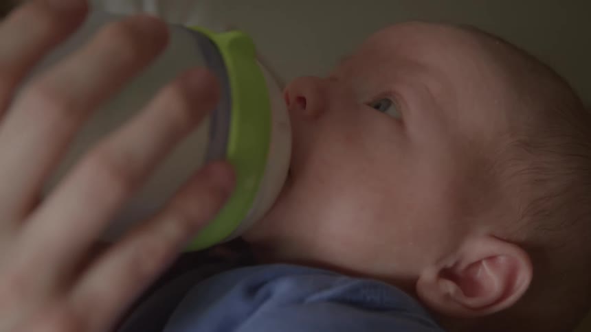 Baby drinking milk from a bottle