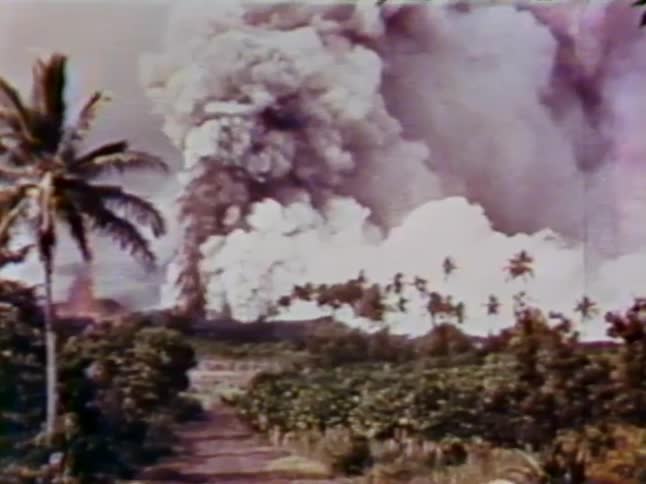 A volcano is erupting on the field ahead