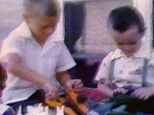 Two children examine some items together