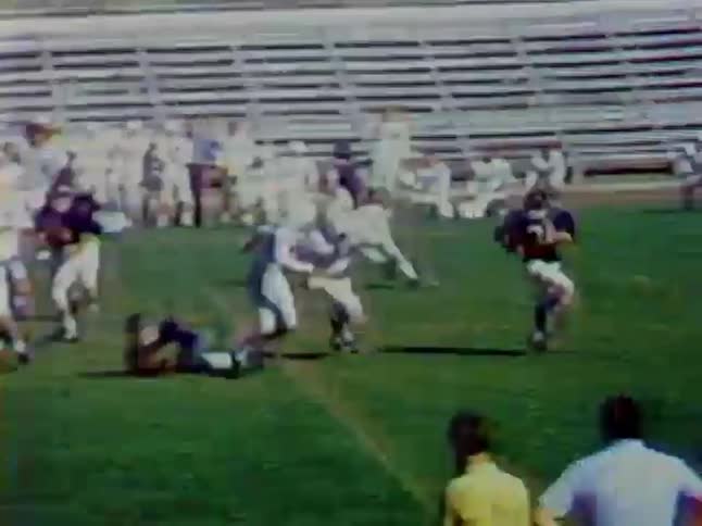 Two teams play football on a field