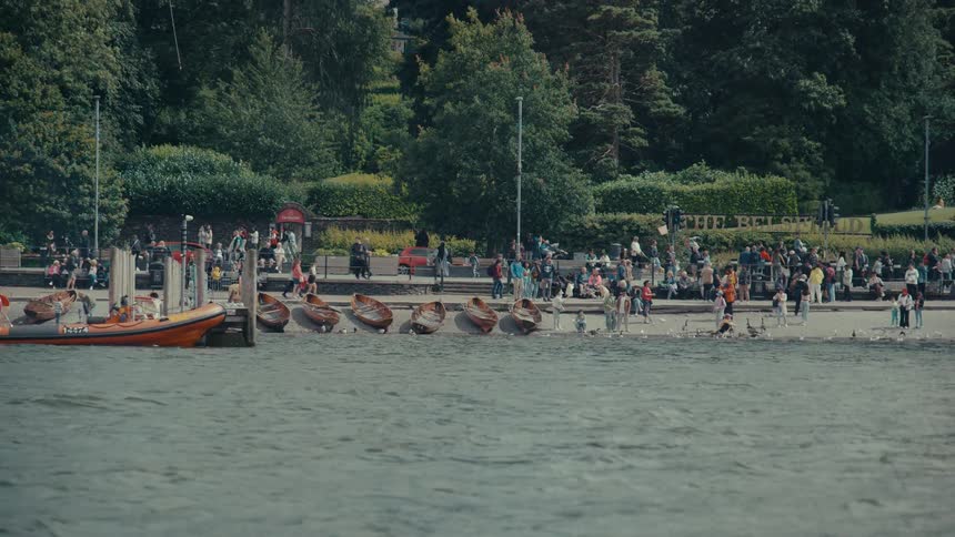 The park is full of people by the shore